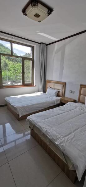 Xiurui Guesthouse at Jinshanling Great Wall - slaapkamer