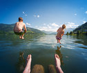 boy and girl swim in lake